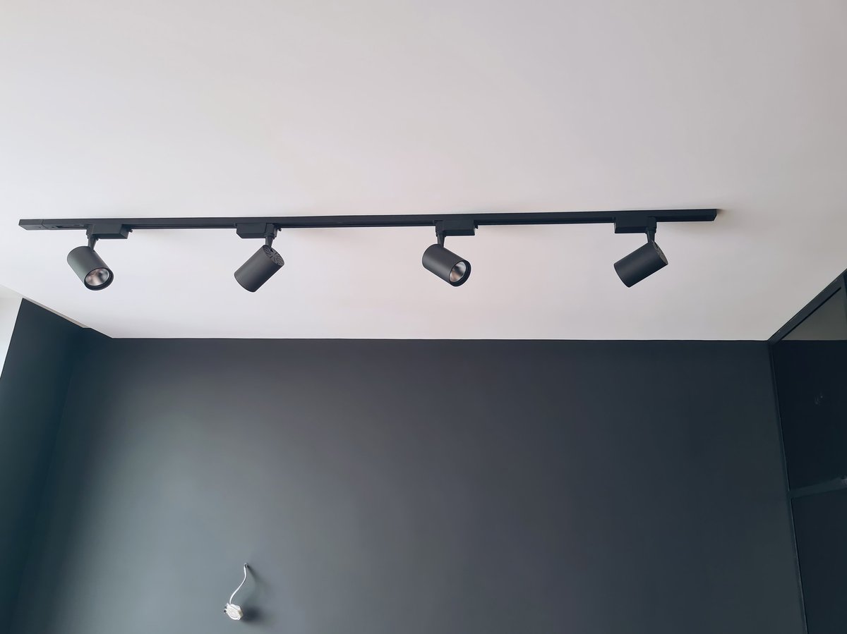 Modern LED track lighting system with adjustable spotlights on white ceiling — CN Electrical pot light retrofit and LED upgrade in Chilliwack, BC